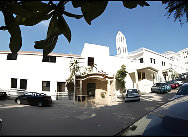 Architecture and vehicles under clear blue sky
