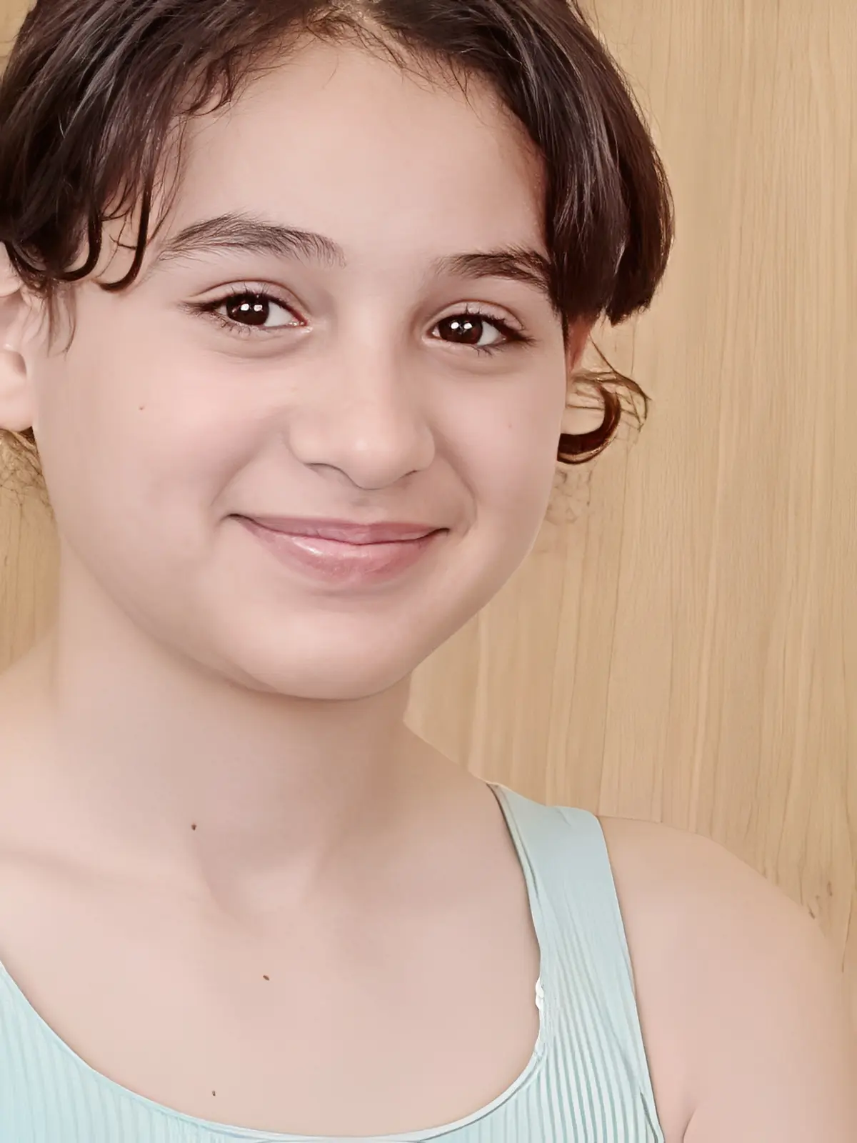 Young girl with short hair smiling