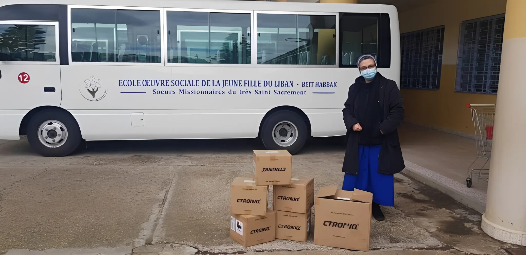 Boxes stacked outside school bus
