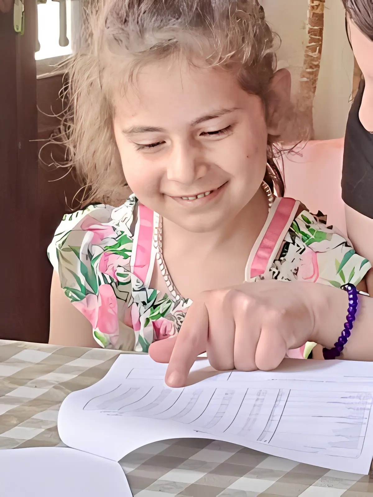 Happy child learning at a table