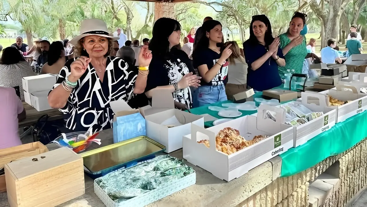 Women selling goods at outdoor event