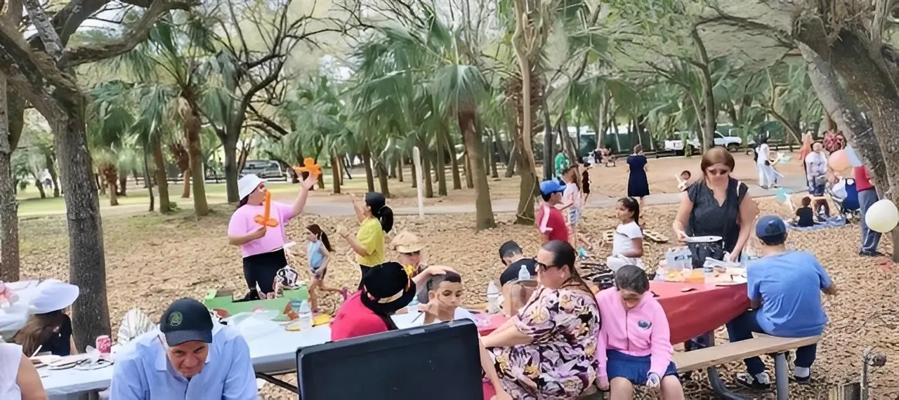 Outdoor family gathering with picnic tables