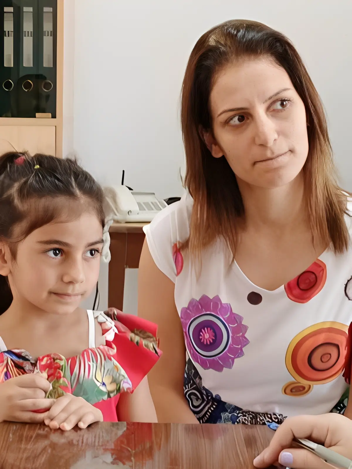 Mother and daughter sitting together