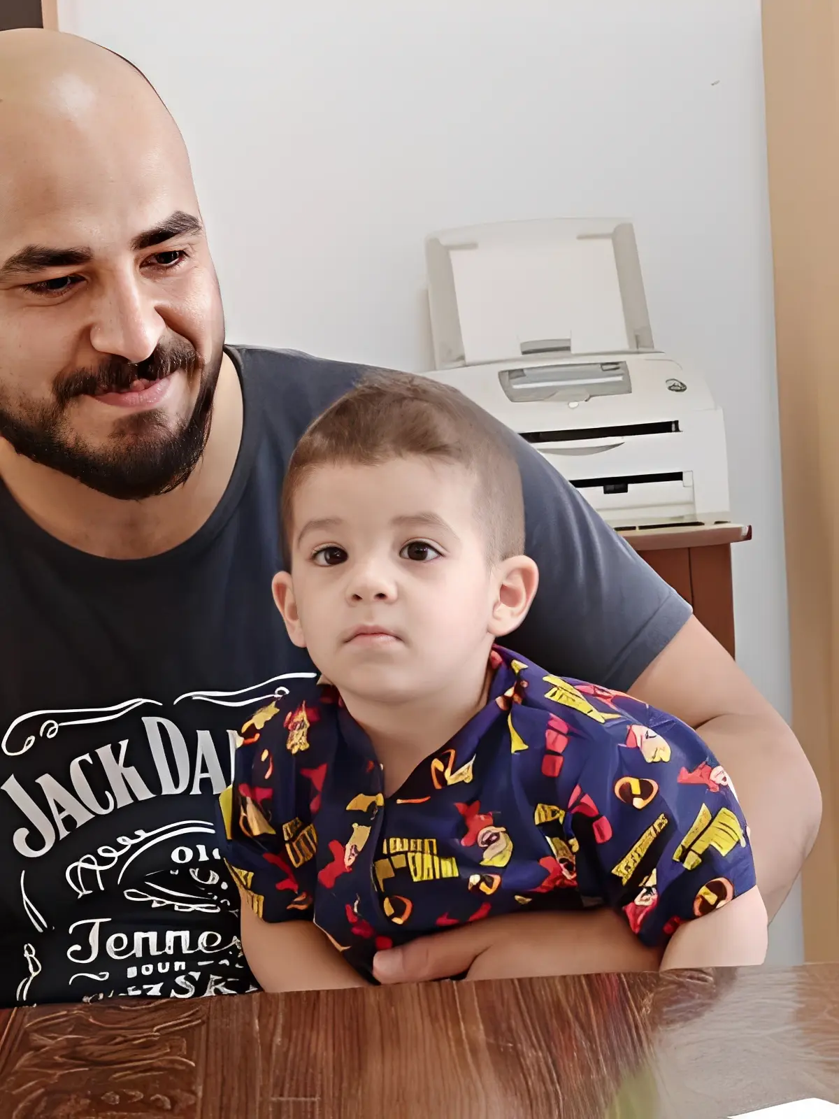 Father and son sitting together